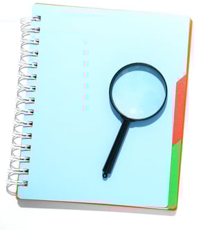 Magnifying Glass and Notepad